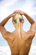 Photo: Rear view nude woman standing on the beach Rear view nude woman standing on the beach