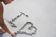 A young girl writing in the sand