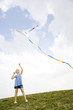 Photo: girl flying kite girl flying kite