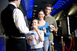 Family at the cinema handing tickets to the usher