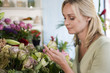 Woman choosing flowers in a florist's shop