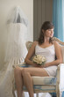 A bride sitting in a chair