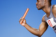 Relay runner with baton in his hand