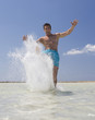 A man splashing in the sea
