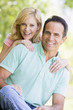 Couple outdoors smiling