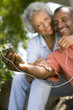 Senior couple with MP3 player, smiling