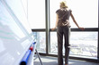 Woman by whiteboard, rear view