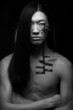 Asian man with long hair