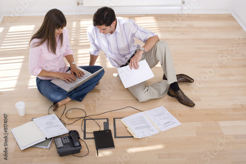 Photo: Young couple, woman with laptop computer Young couple, woman with laptop computer