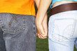A couple holding hands.