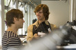Men looking at clothes at a boutique.