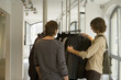 Men looking at clothes at a boutique.