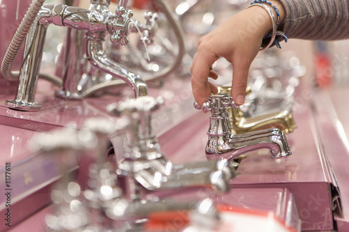 Photo: Man shopping in hardware store, close-up of hand Man shopping in hardware store, close-up of hand