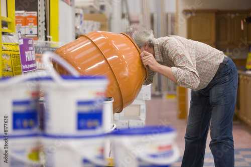 Photo: Man shopping in hardware store Man shopping in hardware store