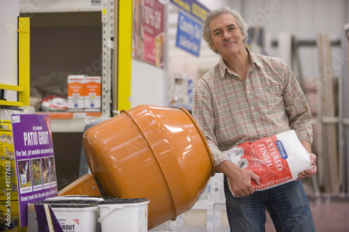 Photo: Man shopping in hardware store, portrait Man shopping in hardware store, portrait