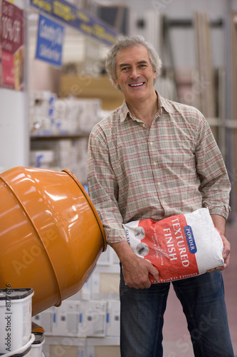 Photo: Man shopping in hardware store, portrait Man shopping in hardware store, portrait