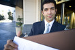 Businessman with briefcase outside of hotel