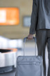 Businesswoman pulling luggage