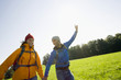 A couple having fun while hiking.