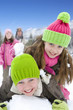 Family playing in snow