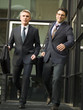 Two businessmen leaving office.