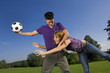 Friends playing football.