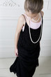 Young girl playing at dressing up