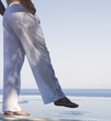 A man standing by a pool