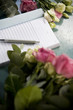 Order book and pen lying on the counter of a florist's shop