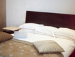 A laptop lying on a bed.