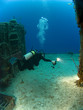 Underwater Photographer with Strobe Firing