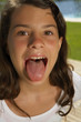 Girl sticking her tongue out.