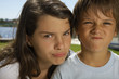 Boy and girl making faces.