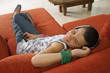 Girl listening to her music player.