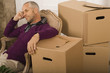Mid adult man sitting in an armchair and thinking
