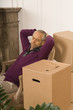 Mid adult man sitting in an armchair with his eyes closed