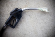 gas pump with money in the nozzle