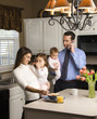 Photo: Family in kitchen. Family in kitchen.