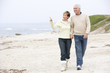 Photo: Couple walking on the beach Couple walking on the beach