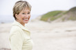 Photo: Woman at the beach smiling Woman at the beach smiling