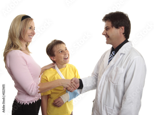Photo: Parent thanking doctor after child medical treatment Parent thanking doctor after child medical treatment