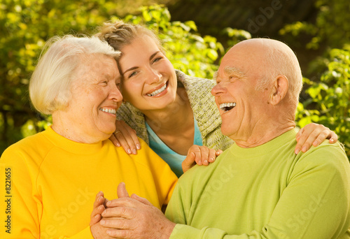 Grandparents with granddaughter outdoors