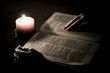 Reading the bible with candlelight Reading the bible with candlelight