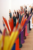 Photo: Row of multi-coloured colouring pencils in pots, close-up (still life, differential focus) Row of multi-coloured colouring pencils in pots, close-up (still life, differential focus)