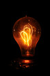 Edison light bulb with looping carbon filament. Edison light bulb with looping carbon filament.