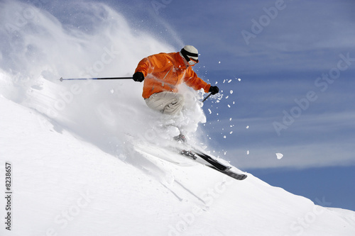 Austria, Saalbach, male skier jumping on slope
