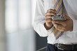 Photo: Businessman using personal electronic organiser and digital pen, close-up, mid-section Businessman using personal electronic organiser and digital pen, close-up, mid-section