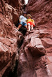 Couple climbing in red rocks