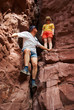 Couple climbing in red rocks