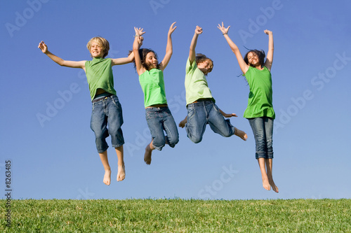 Photo: group of happy smiling summer children jumping group of happy smiling summer children jumping